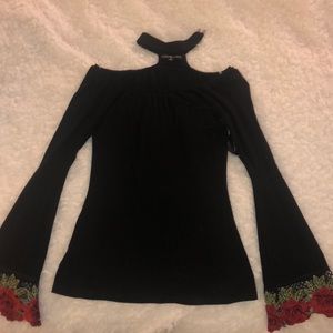 Black top with flared rose embroidered sleeves